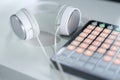 White headphones lying near music mixer console concept Royalty Free Stock Photo