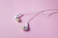 White headphones on a pink background. Royalty Free Stock Photo
