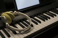 A headphones on electric piano keys Royalty Free Stock Photo