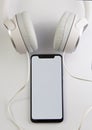 White headphones and smartphone music online concept, mockup, isolate on white