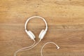 White headphones on wood Royalty Free Stock Photo