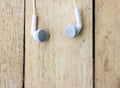 White headphones on wood Royalty Free Stock Photo