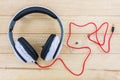 White Headphones on wood desk.