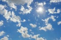 White cumulus clouds in a blue sky