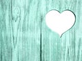 White heart carved in a blue wooden board. Background. Postcard, valentine. Royalty Free Stock Photo
