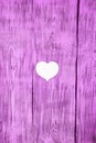 White heart carved in a wooden pink board. Background. Royalty Free Stock Photo