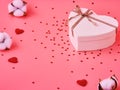 White heart gift box for Valentine`s Day on pink background. Flatley. St. Valentine day concept