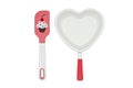 White heart shaped ceramics baking dish cooking pan and pink spatula on white