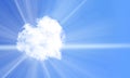 White heart shaped cloud on blue sky,through which the rays of the sun break through Royalty Free Stock Photo