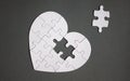 White heart shaped puzzle with missing part