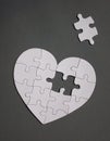 White heart shaped puzzle with missing part