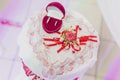 Red box with wedding rings lies on white table in shape of a heart. Royalty Free Stock Photo