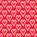 White heart shapes made by triangles seamless pattern on red vector background Royalty Free Stock Photo
