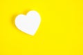 White heart yellow background.Festive background for Valentines Day