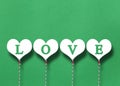 White hearts on a green paper background Royalty Free Stock Photo