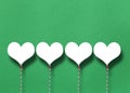 White hearts on a green paper background Royalty Free Stock Photo