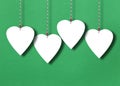 White hearts on a green paper background Royalty Free Stock Photo