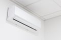 White heating and cooling air conditioner on white wall in office or home Royalty Free Stock Photo