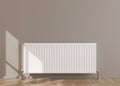 White heating radiator on grey wall. Central heating system. Free, copy space for your text. 3D rendering.