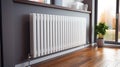 white heating radiator hanging on the wall in the living room, close-up