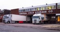 White heavy iveco stralis truck with refrigerated shipping container being unloaded at a cold store in Walsall UK