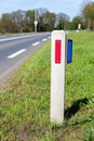 White hectometer marker along dutch road Royalty Free Stock Photo