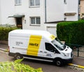 White HERTZ rent a van service seen from above on a French stree