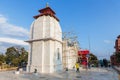 White Hindu marble skin temple with red roof and construction site in the area of Siddhesvara Dhaam in Namchi. Sikkim, India Royalty Free Stock Photo
