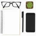 White hipster desk with notebook, pen, smartphone and eye glasses. Top view, flat lay Royalty Free Stock Photo