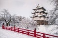 Hirosaki Castle and its red wooden bridge in winter season, Aomori, Tohoku, Japan Royalty Free Stock Photo