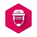 White Hockey helmet icon isolated with long shadow. Pink hexagon button. Vector