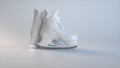 White Hockey Ice Skates on a Soft Gray Studio Background.