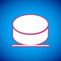 White Hockey puck icon isolated on blue background. Vector