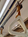 a white holder installed in the commuter line Royalty Free Stock Photo