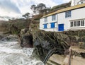 White Holiday Cottage by the Sea, on the coast path,Polperro, Cornwall, UK Royalty Free Stock Photo