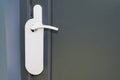 White home door hanger on grey classic door with empty label do not disturb Royalty Free Stock Photo