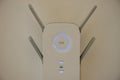 White home WiFi extender repeater on white wall Royalty Free Stock Photo