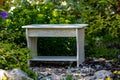 White homemade stool on the background of nature