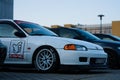 White Honda Civic V car with tuning for racing parked outdoors during the daytime