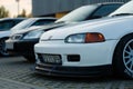 White Honda Civic V car with tuning for racing parked outdoors during the daytime