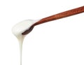 White honey pouring from little wooden spoon Royalty Free Stock Photo