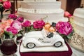 White.honeymoon car with cake. pedal car, wedding decoration. Wedding concept Royalty Free Stock Photo