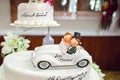 White.honeymoon car with cake. pedal car, wedding decoration. Wedding concept Royalty Free Stock Photo