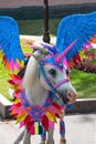 Horse portrait in carnival unicorn dress.
