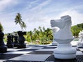 White Horse figure close up, giant Black and White big Chess figures for playing on the ground board by the sea, chess pieces, Royalty Free Stock Photo