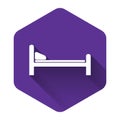White Hospital Bed icon isolated with long shadow. Purple hexagon button