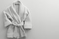 white hotel fleece bathrobe on a white background Royalty Free Stock Photo