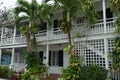 White house with balcony and veranda built in typical colonial style in Nassau, Bahamas. Royalty Free Stock Photo