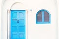 White house with blue door and window in classic style Royalty Free Stock Photo