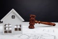 White house, drawing and wooden judges gavel. Law and construction concept